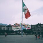 people near mexican flag
